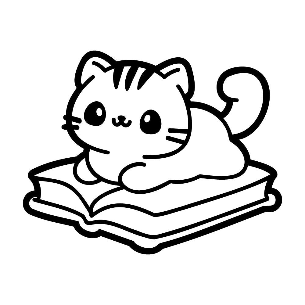 本の上に乗るネコ
